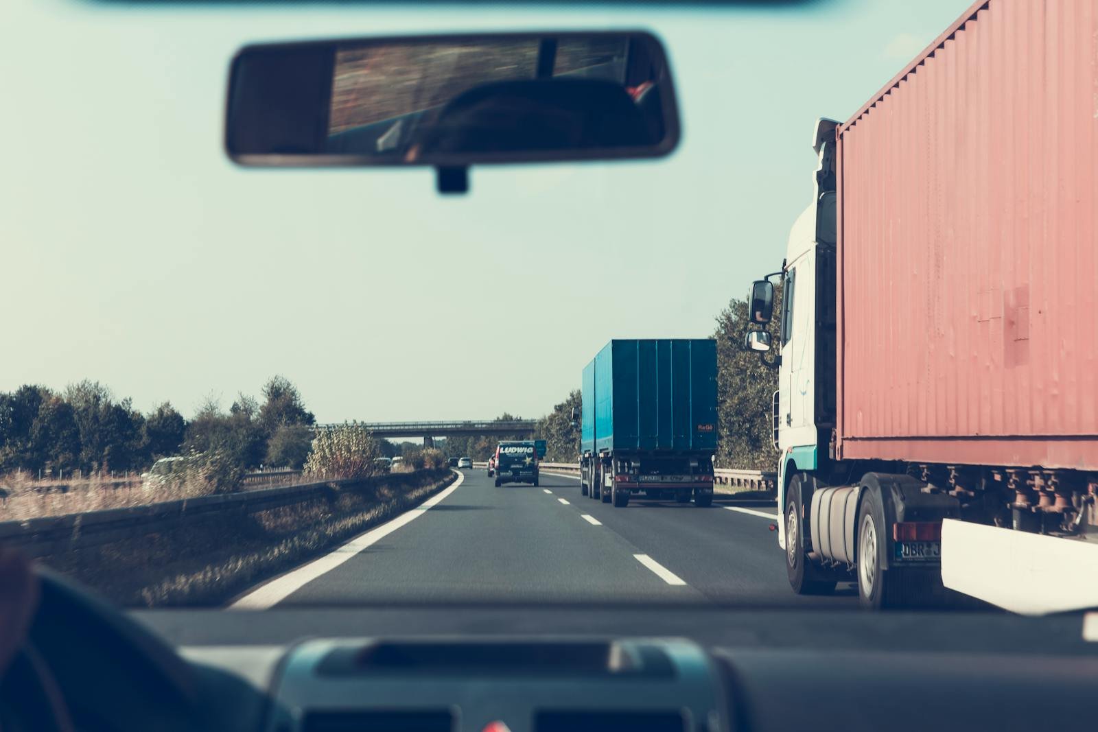 Articulated trucks hauling containers on an Indian national highway